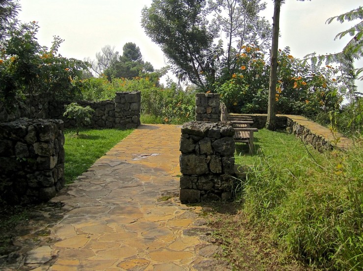 The central path crosses a garden room.