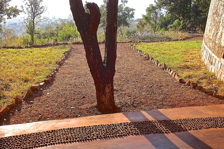 Pebble floor border, welcome center, Akagera Nat'l. Park in Rwanda:enclos*ure