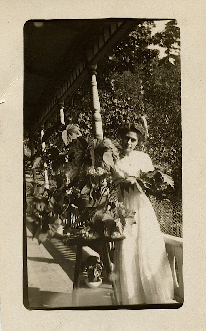 The Sunday porch/enclos*ure: woman with begonia, via Texas State Archives on flickr