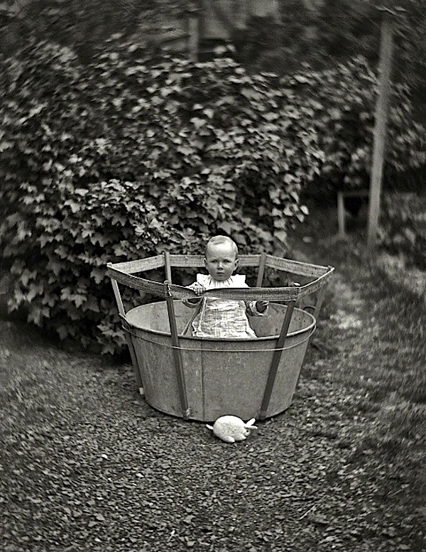 Baby in bucket, by W. Williams, via Shorpy
