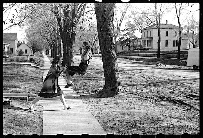 Girl swinging, Woodbine, J. Vachon, via LoC