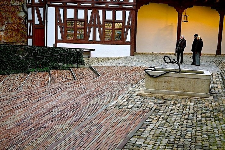 Above, looking east, with the entrance to the courtyard at the upper right.