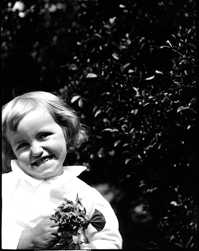 Child with violets cropped, ca. 1900, Mississippi Dept of Archives and History